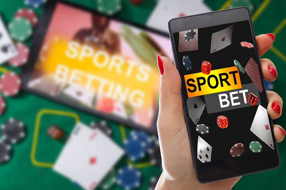 inscription your bet wins on a smartphone on the poker table. Bets, sports betting, bookmaker. Mixed media.