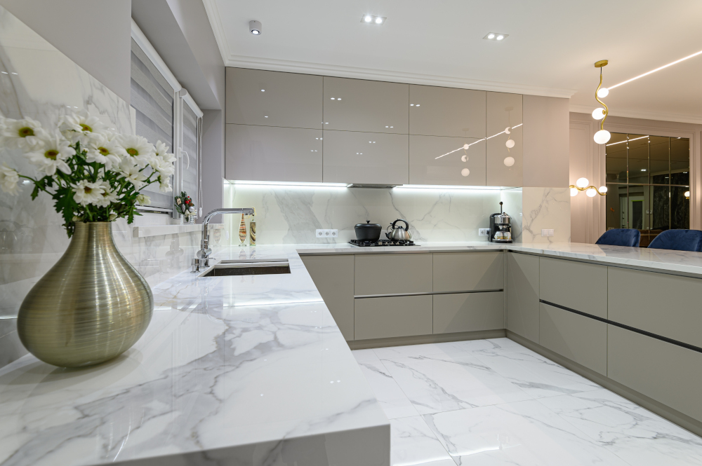 Closrup of luxury large modern white marble kitchen united with dining room