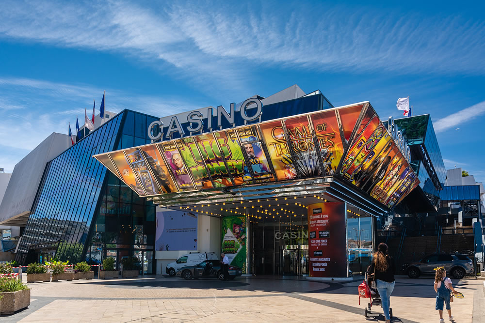 Colorful facade with advertising of Casino Barriere Le Croisette located in the Palais des Festivals et des Congres in Cannes