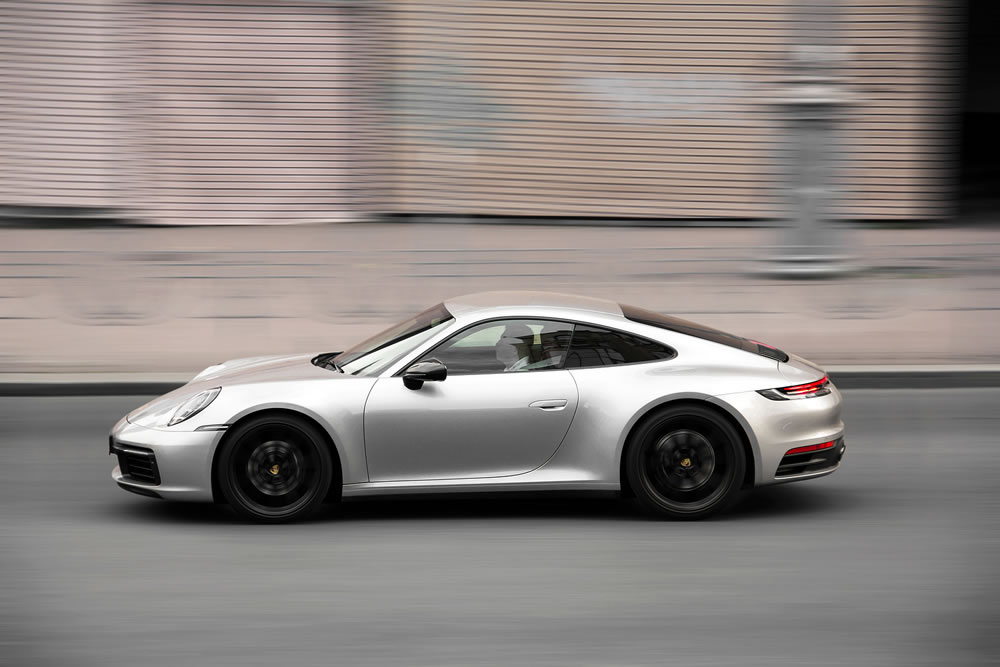 Gray supercar Porsche 911 in motion