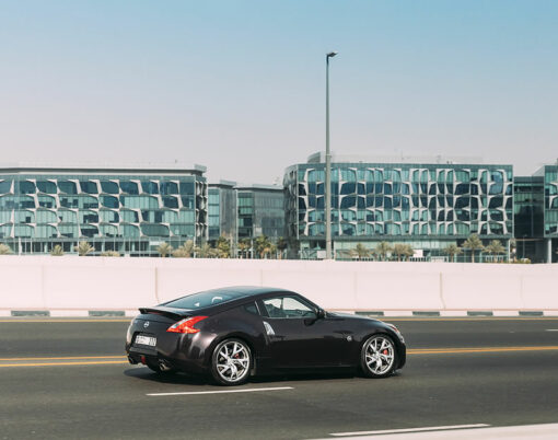 Black Nissan 350Z car fast mooving on street in Dubai