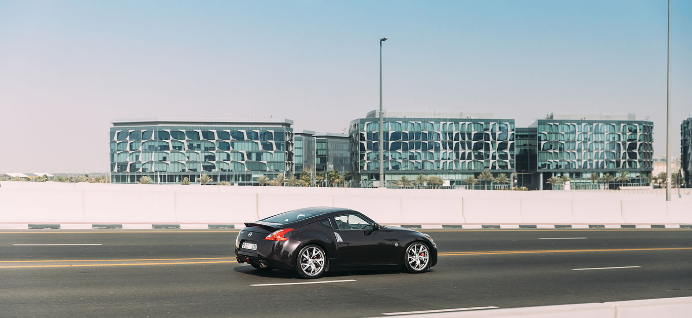 Black Nissan 350Z car fast mooving on street in Dubai