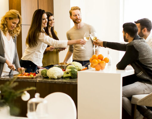 Group of young friends toasting with white wine joyous event