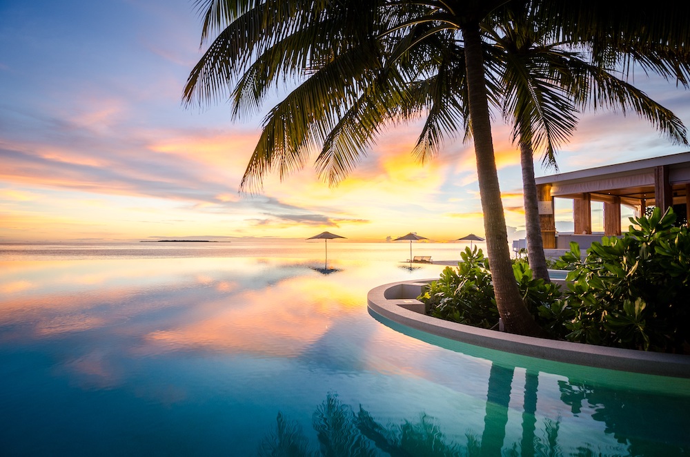 Amilla Maldives sunset by the pool