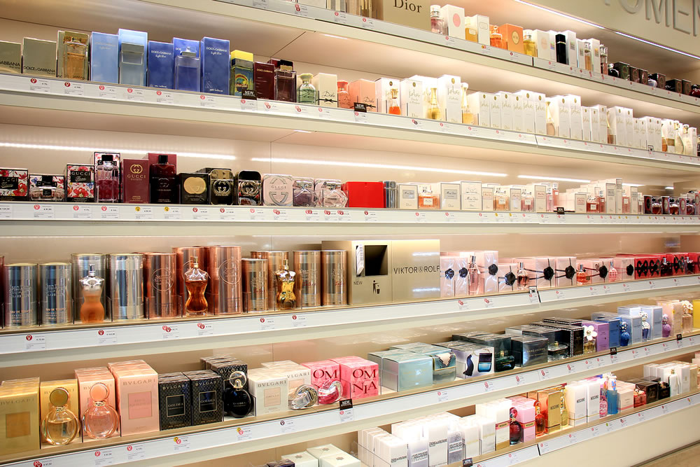 different brands of perfume in a store