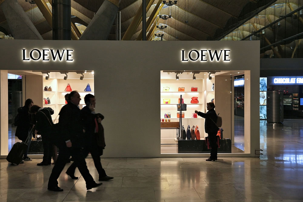 Passengers visit Loewe fashion shop at Madrid Airport in Spain