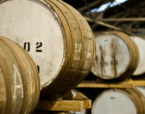 A huge warehouse of aging whisky barrels