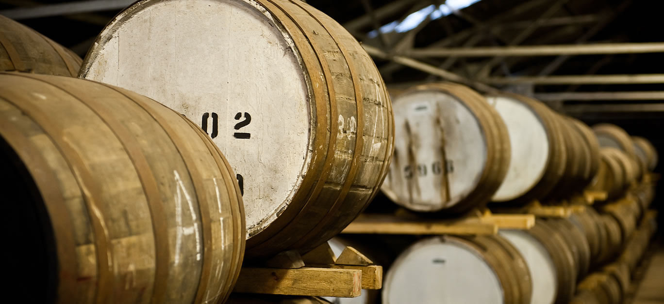 A huge warehouse of aging whisky barrels