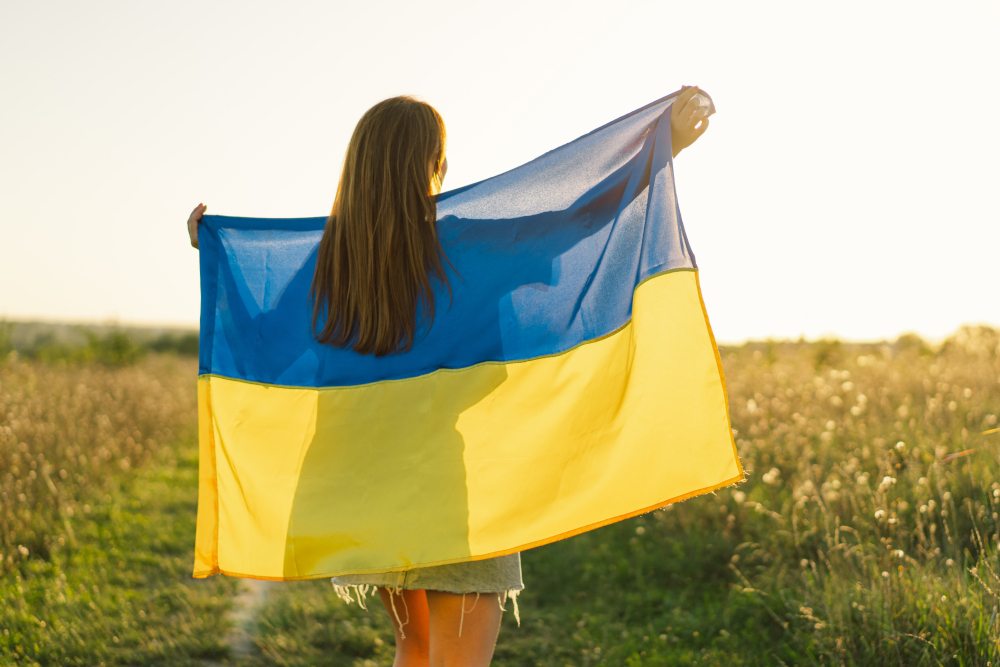 Ukrainian woman with yellow and blue flag of Ukraine