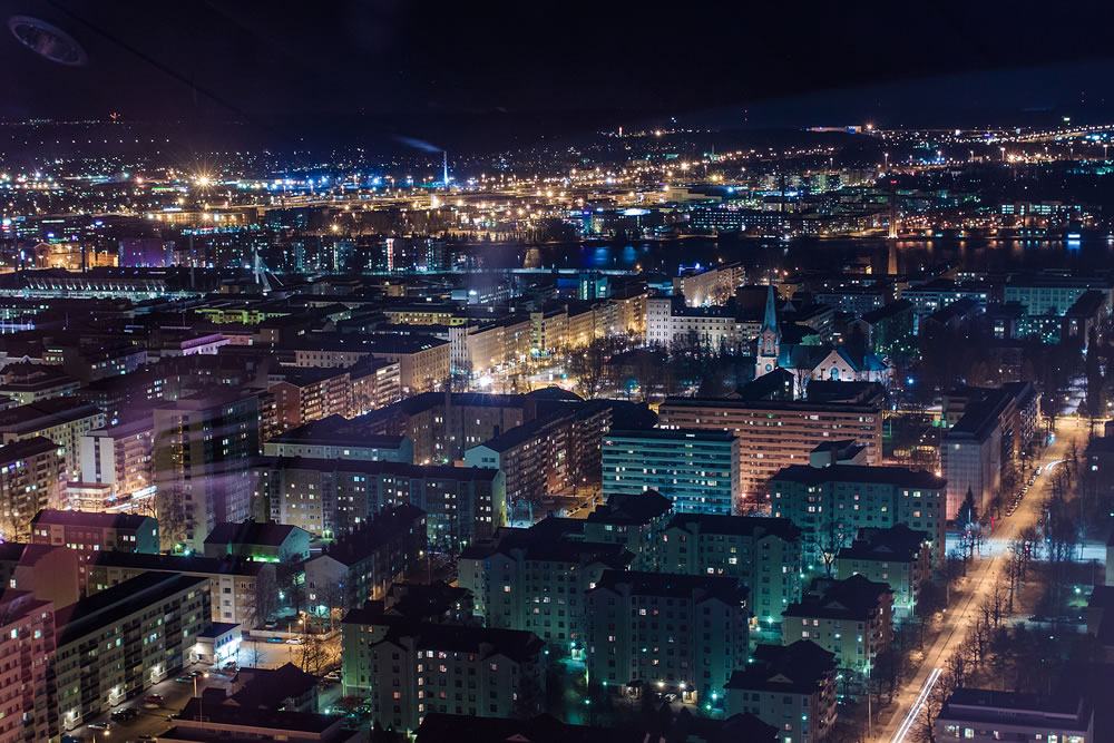 The town of Tampere in the night time seen from the Nasinneula view tower.