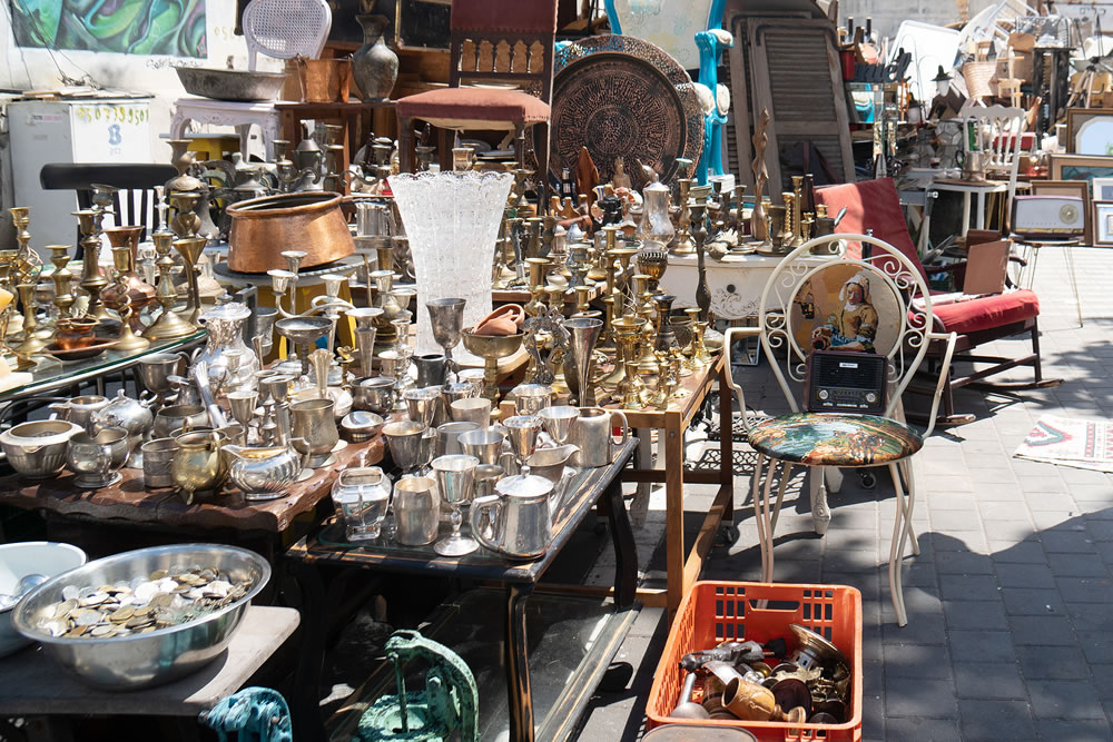 Retro old antique objects are being sold at flea market on the Tel Aviv Jaffa sreet in sunny summer morning
