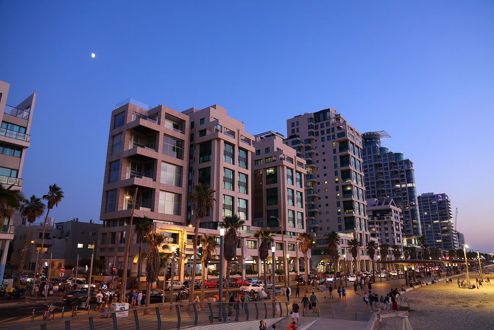 People visit beachfront promenade (Tayelet) in Tel Aviv, Israel