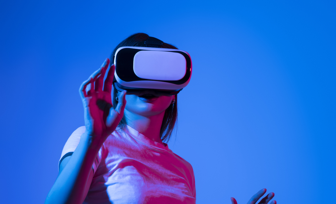 Woman in white shirt wearing VR glassess
