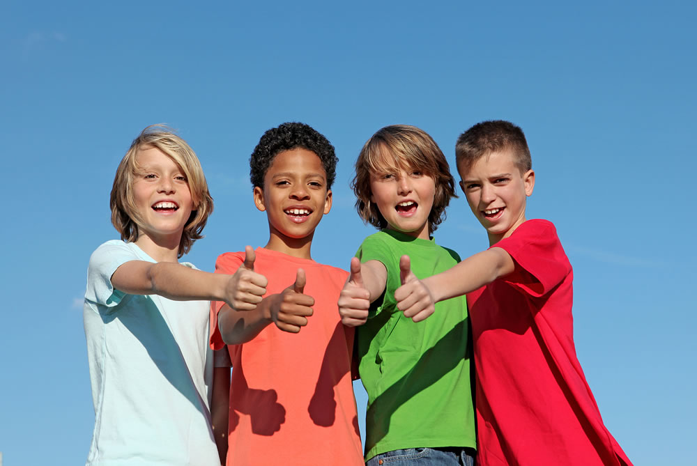 group of diverse happy smiling kids with thumbs up