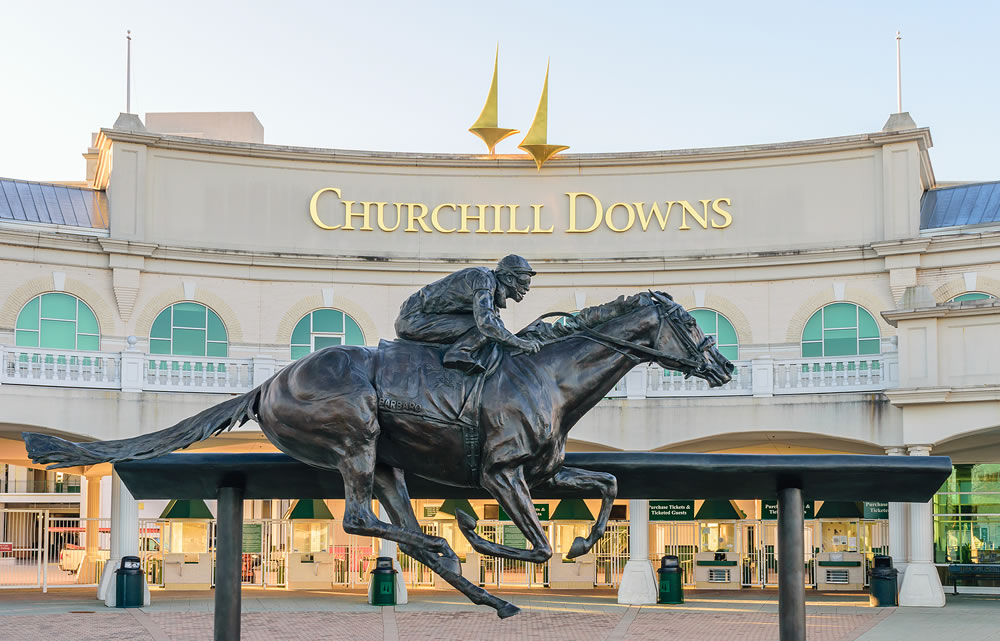 Entrance to Churchill Downs featuring a statue of Kentucky Derby Champion Barbaro.