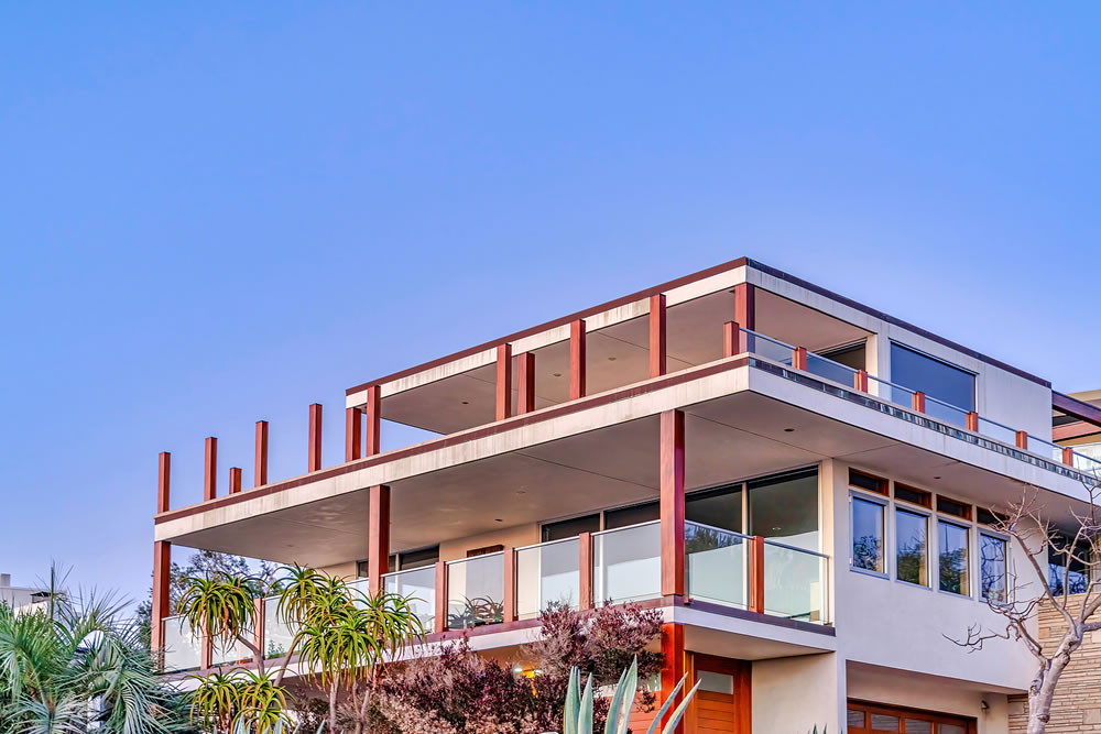 Modern three storey house with balconies and flat roof in San Diego California