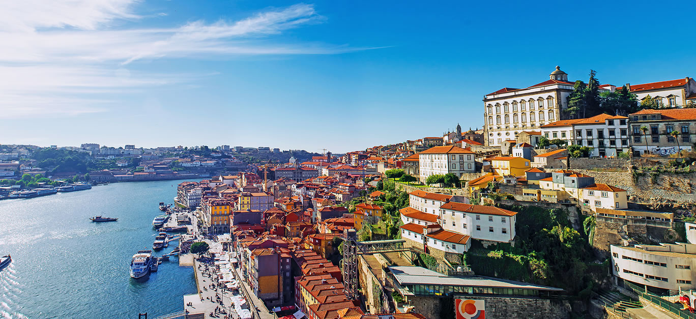 Porto Portugal old town skyline from Dom Luis bridge on the Douro River.
