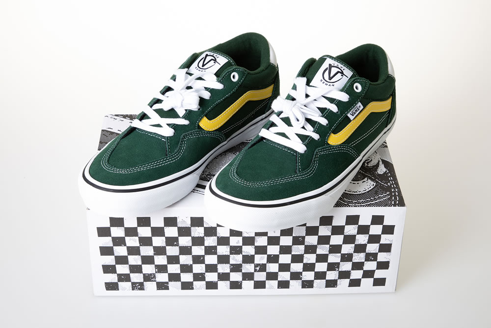 Vans rowan logo text and brand sign closed checkered shoe box with green sports shoes fashion us footwear apparel company skateboarding