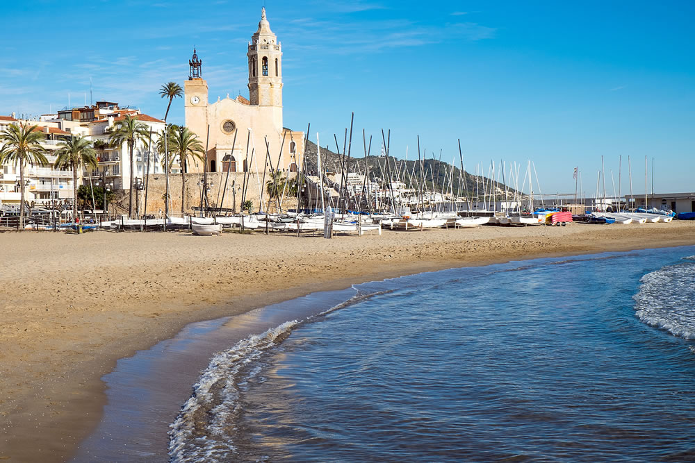 The church and the beach in Sitges, a small town near Barcelona