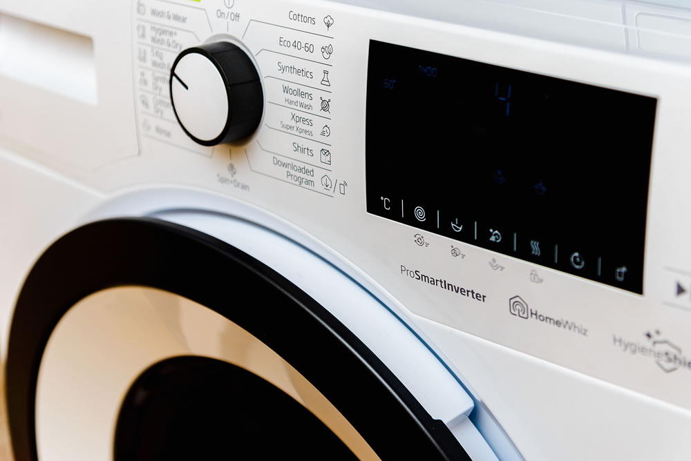 Display washing dryer machine. Macro photo part of modern home washing dryer machine dial.