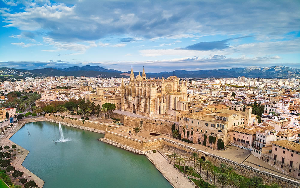 Aerial drone view Palma de Mallorca Cathedral was built on a cliff rising out of the sea