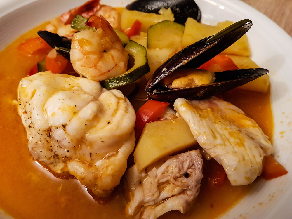 all ingredients for a portuguese seafood cataplana