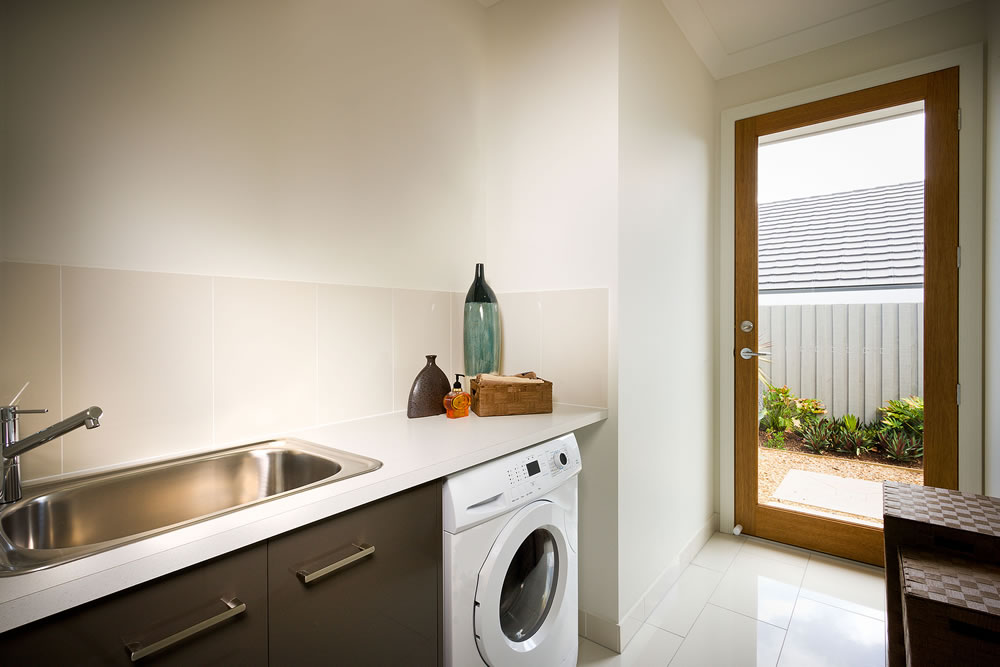Beautiful washing room with a washing machine and a sink