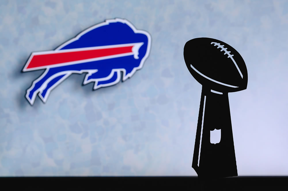 Buffalo Bills professional american football club, silhouette of NFL trophy, logo of the club in background.