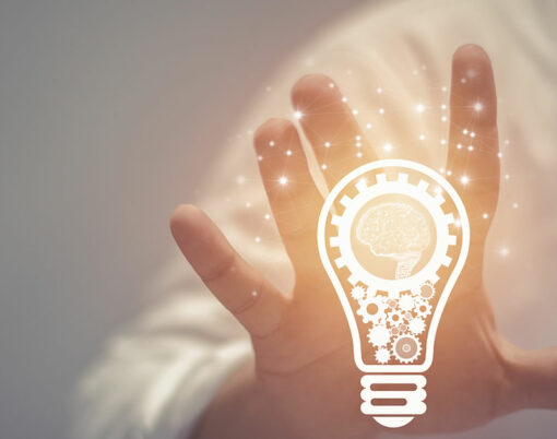 Business idea and vision, businessman holding light bulb, concept of new ideas, innovation, invention and creativity, retro toned image, selective focus.