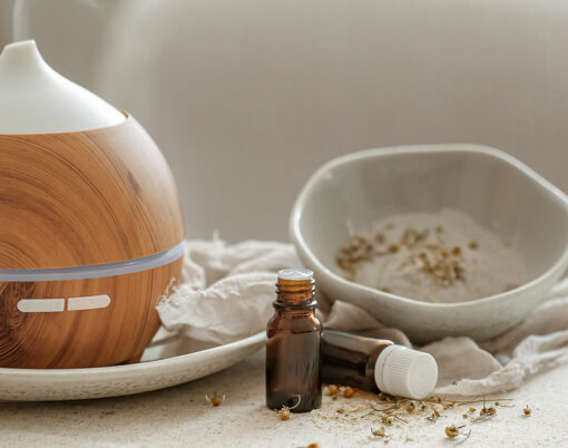 Essential oil aroma diffuser humidifier diffusing water articles in the air.