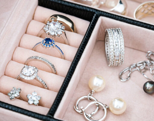 Jewelry box with white gold and silver rings, earrings and pendants with pearls. Collection of luxury jewelry