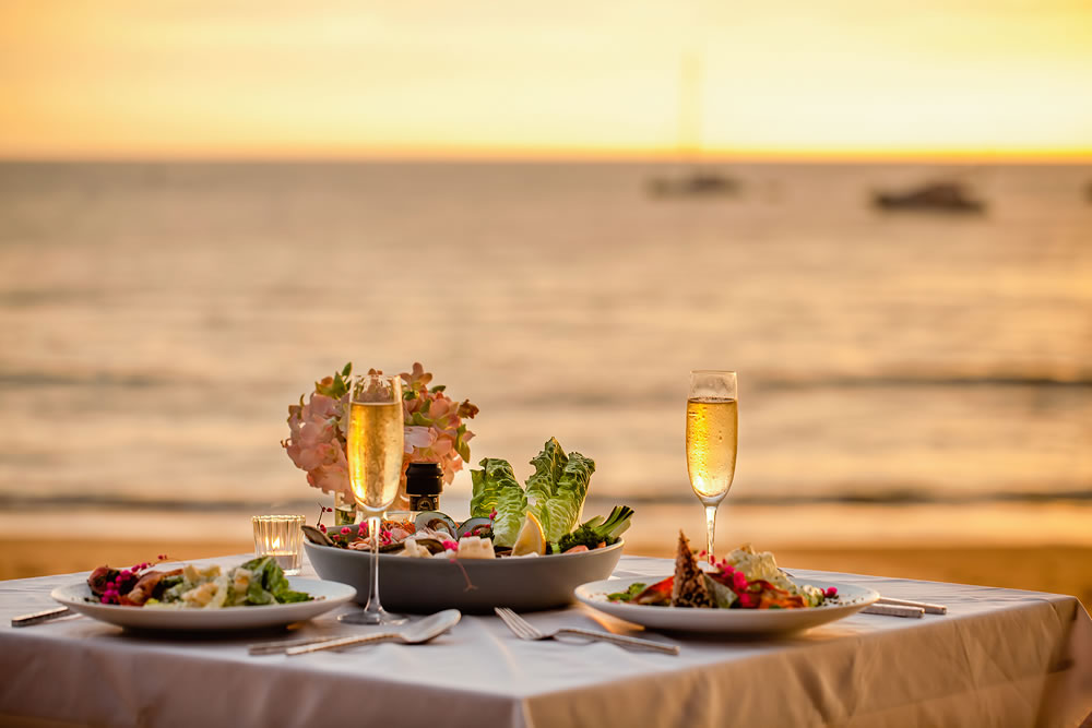 Romantic sunset dinner on beach