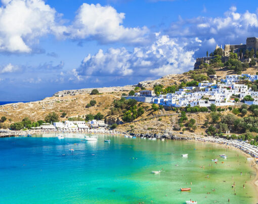 panoramic view of Lindos bay, village and Acropolis, Rhodes, Greece