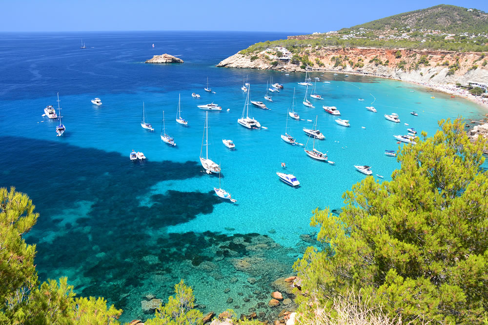 Cala d'Hort bay with beach and turquoise water on Ibiza island, Spain