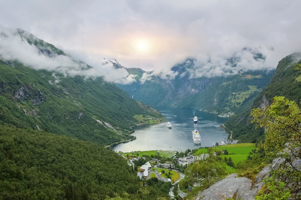 Norwegian Geiranger fjord (UNESCO World Heritage Site), with majestic nature, wild waterfalls and green water and vegetation