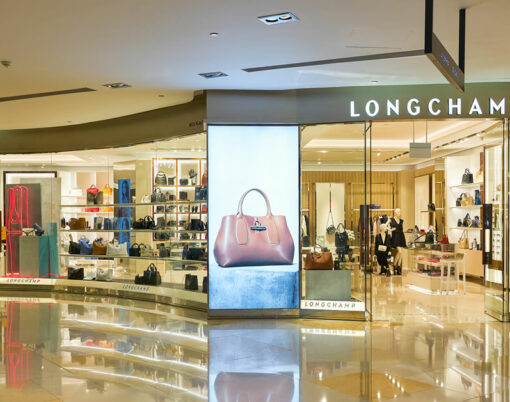 Longchamp storefront in ION Orchard shopping mall in Singapore. Longchamp is a French luxury leather goods company.
