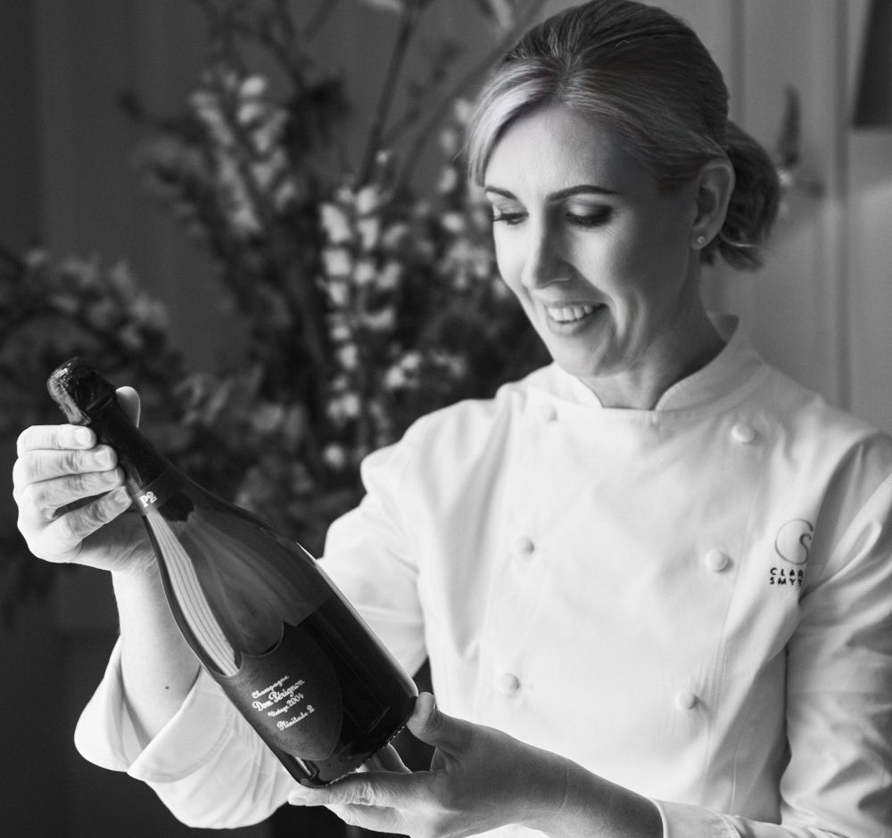 Clare Smyth with bottle of champagne