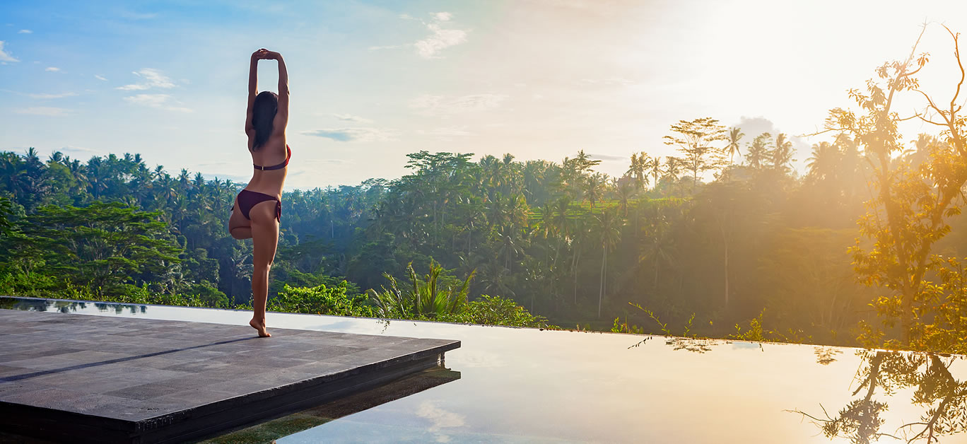 Good morning with yoga meditating on sunrise background