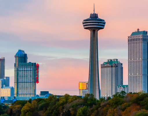 Hotels, casinos, and the Skylon Tower dominate the city skyline at sunset.