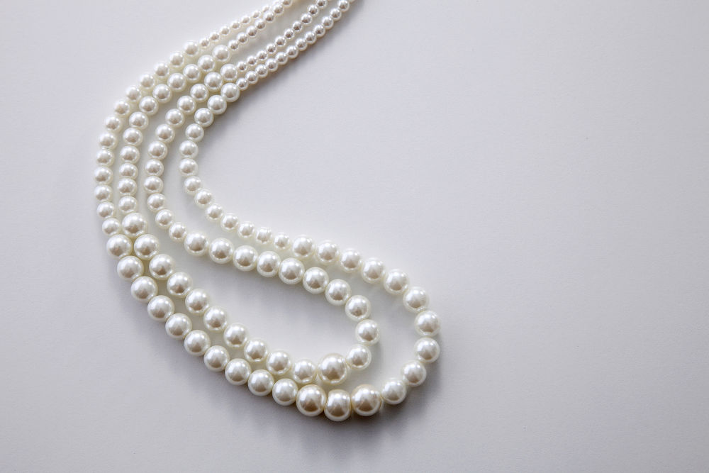 pearls necklace on the white background