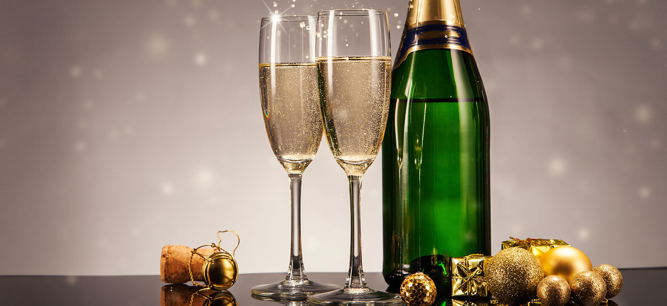 https://www.luxurylifestylemag.co.uk/wp-content/uploads/2023/11/bigstock-Champagne-bottle-with-glasses-75924050.jpg