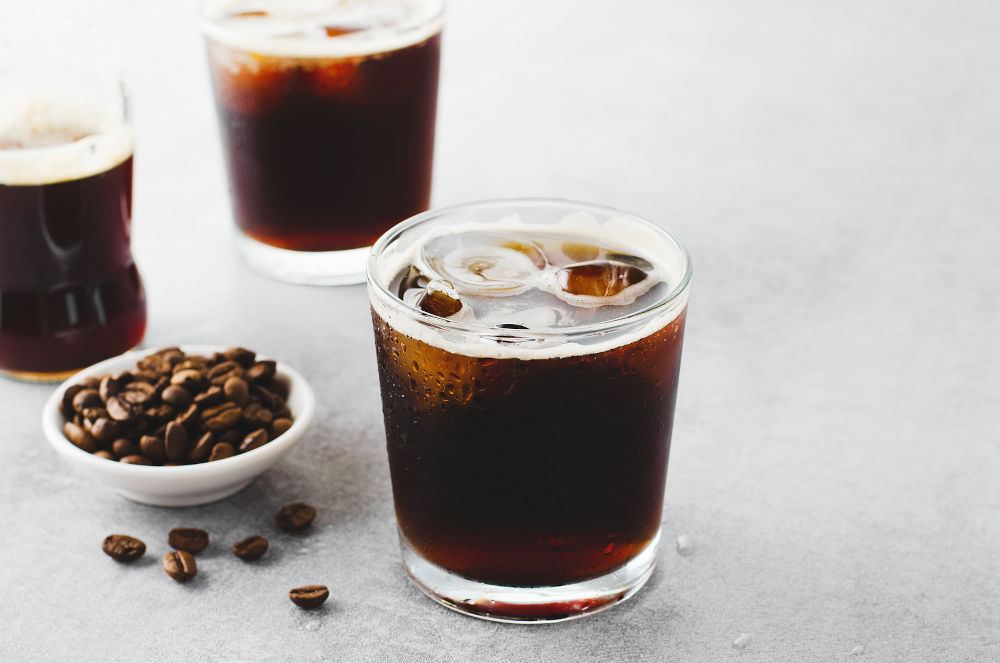 Iced Coffee, Cold Brew Coffee with Ice on Bright Light Grey Background, Refreshing Beverage
