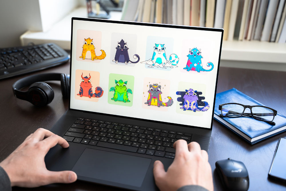 Logo, screenshot of blockchain nft ethereum cryptocurrency game Cryptokitties in laptop screen. Man playing, collecting crypto kitties. Earning digital money at home