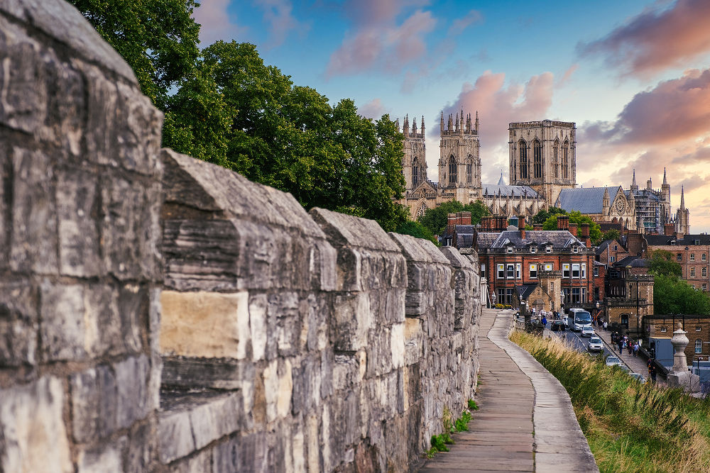 The city of York, its medieval wall and the York Minster at sunset