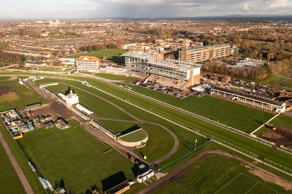 An aerial view of York Racecourse with Grandstand and paddock at the course winning post