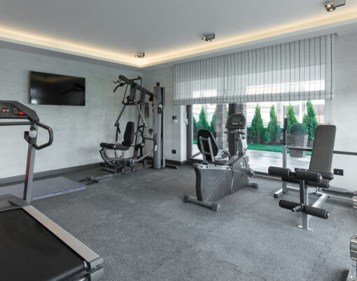 Home gym in luxury villa house with trademill ** Note: Visible grain at 100%, best at smaller sizes