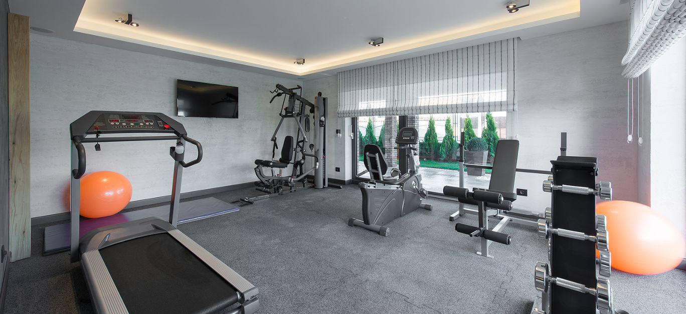Home gym in luxury villa house with trademill ** Note: Visible grain at 100%, best at smaller sizes