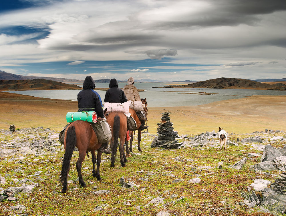 Horseriders in mongolian wilderness