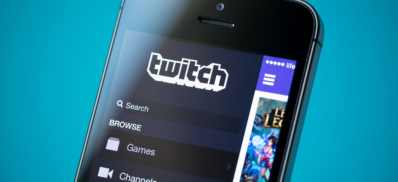 Close-up shot of brand new Apple iPhone 5S with Twitch video streaming service application on a screen.