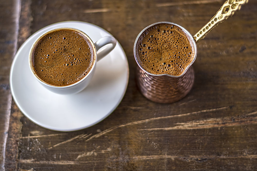 Turkish coffee and coffee pot on wooden background. Top View